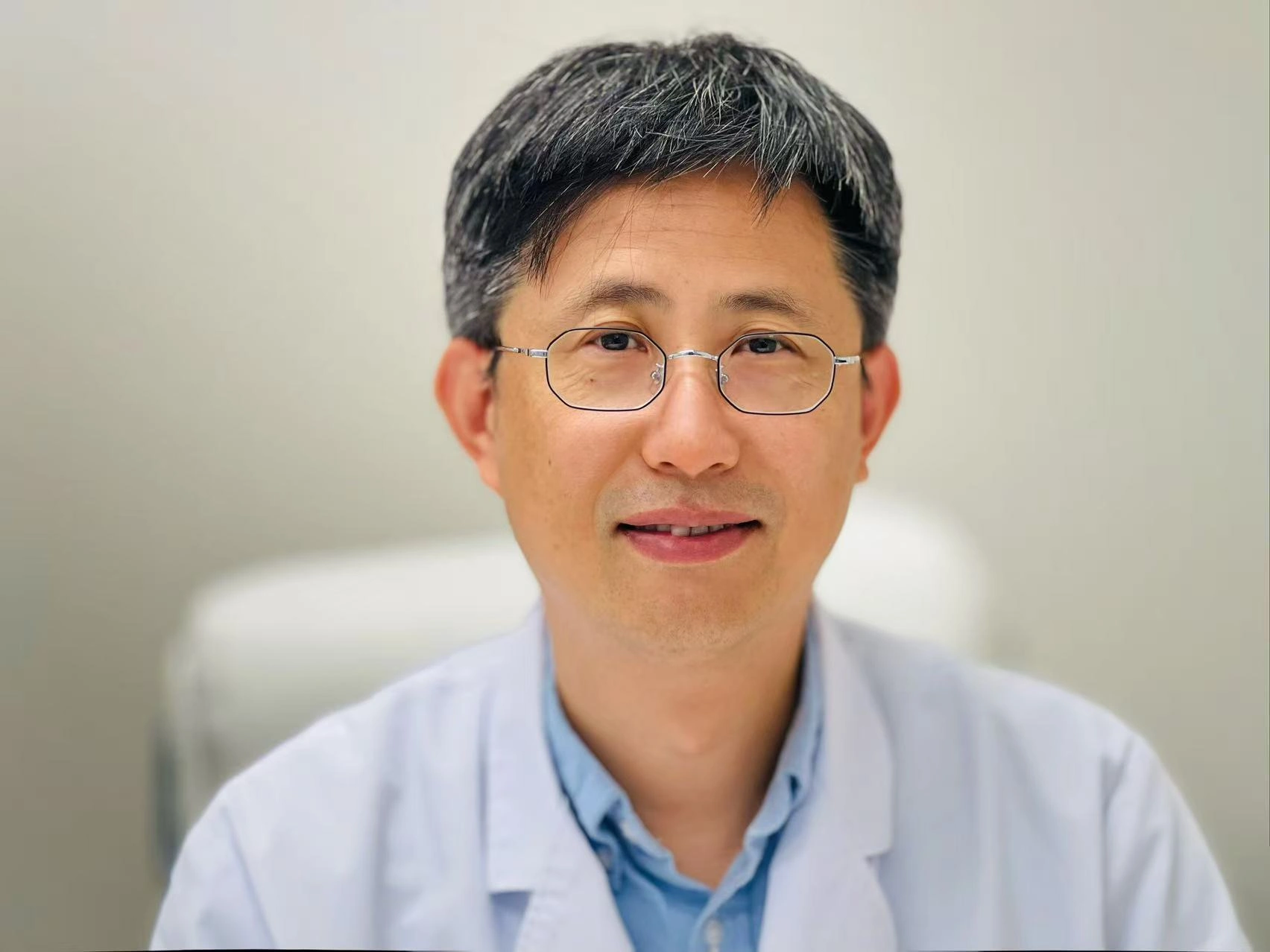 Runsheng Wang, L.AC, licensed acupuncturist and founder of Microcosmos Acupuncture in Newport Beach, CA.